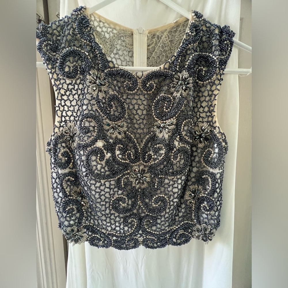 Unique beaded two piece gown.